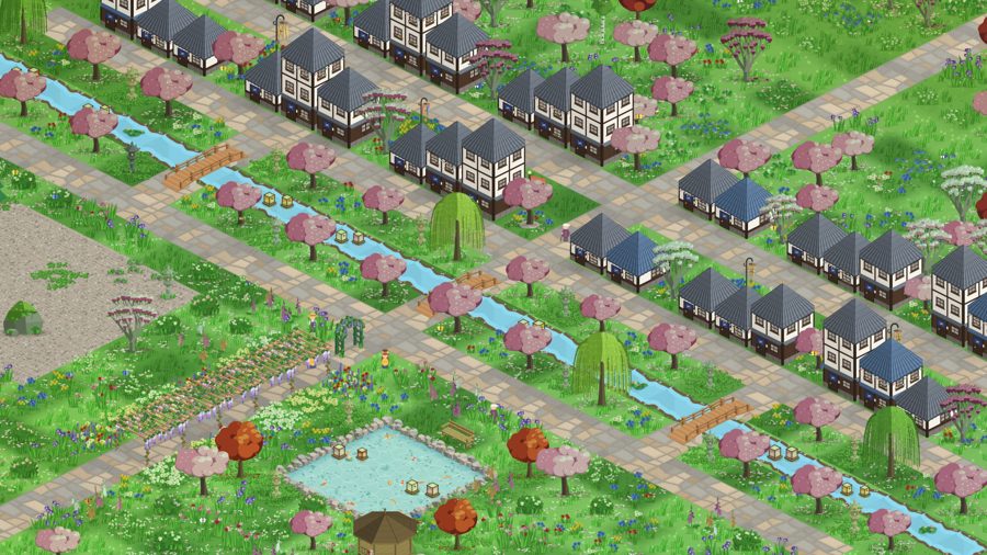 Townhouses along a canal with cherry blossom
